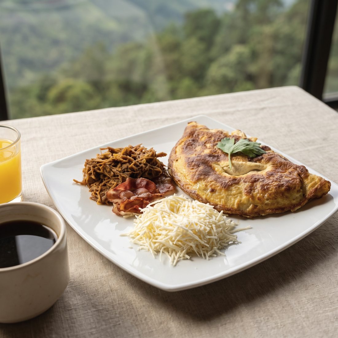Desayuno servido en la terraza, con café, jugo y el valle por la ventana